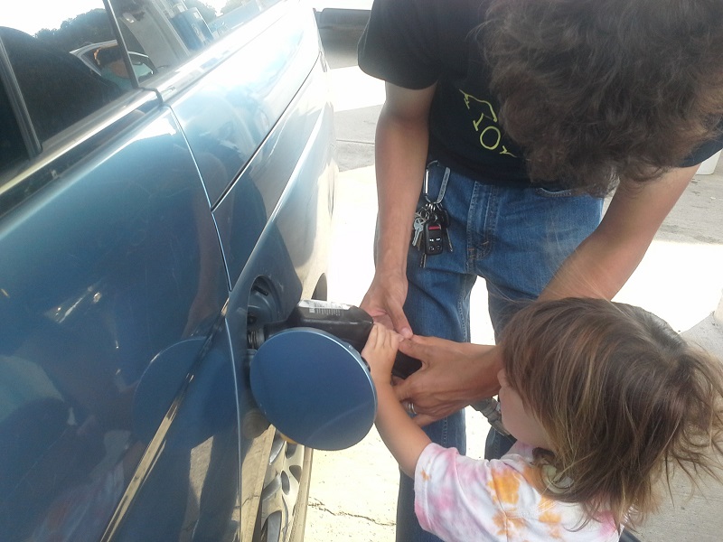 Family Pumping Gasoline