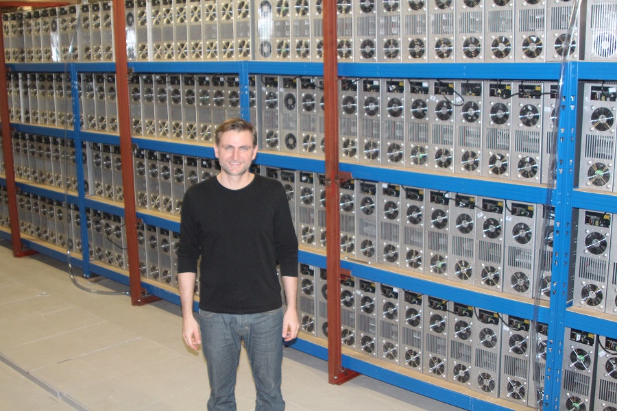 CTO, Stefan Schindler in front of a big batch of miners in Iceland